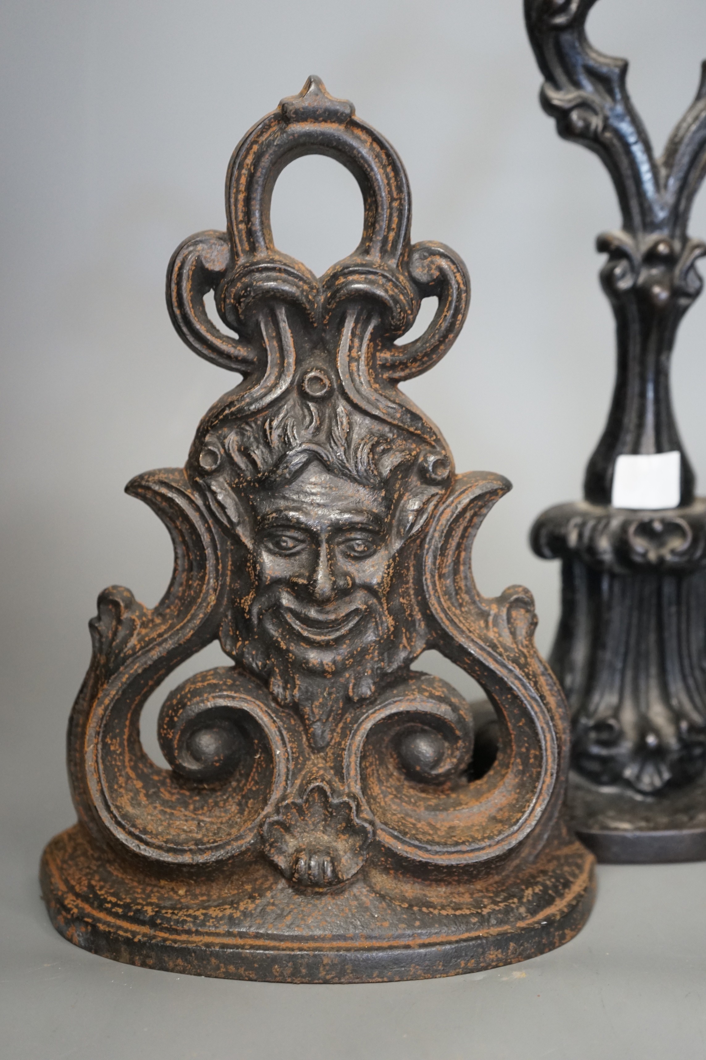 Four cast iron Victorian assorted door stops, tallest 38cm